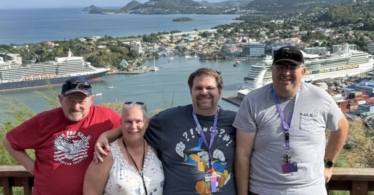 Group travel planning done right with 4 posing in port harbor of St. Lucia